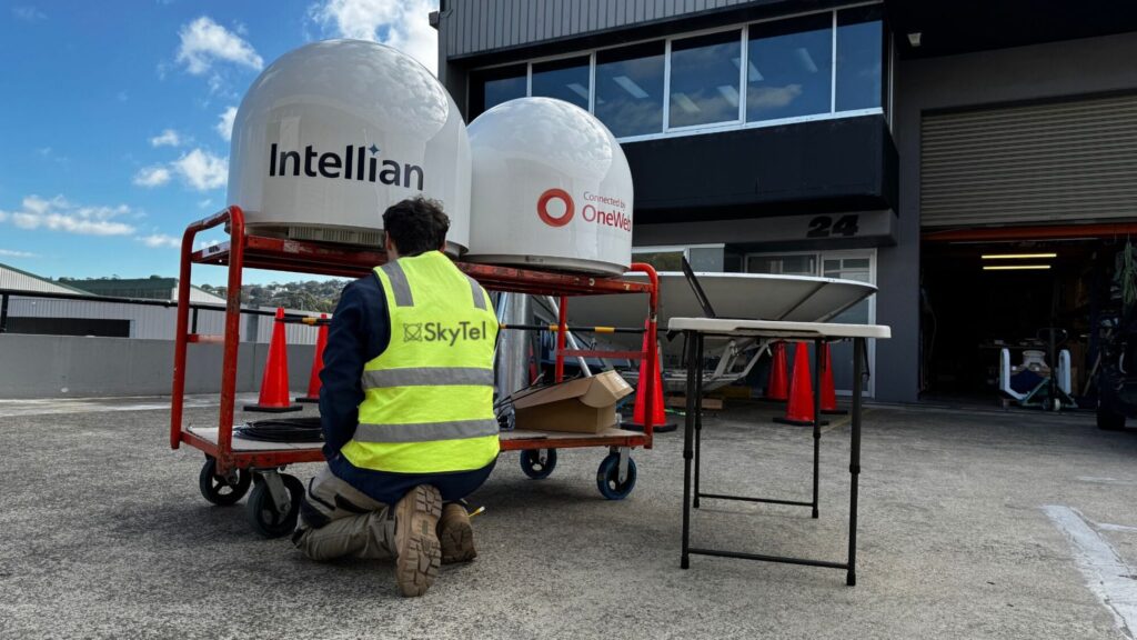 A SkyTel engineer testing the latest intellian satellite terminal